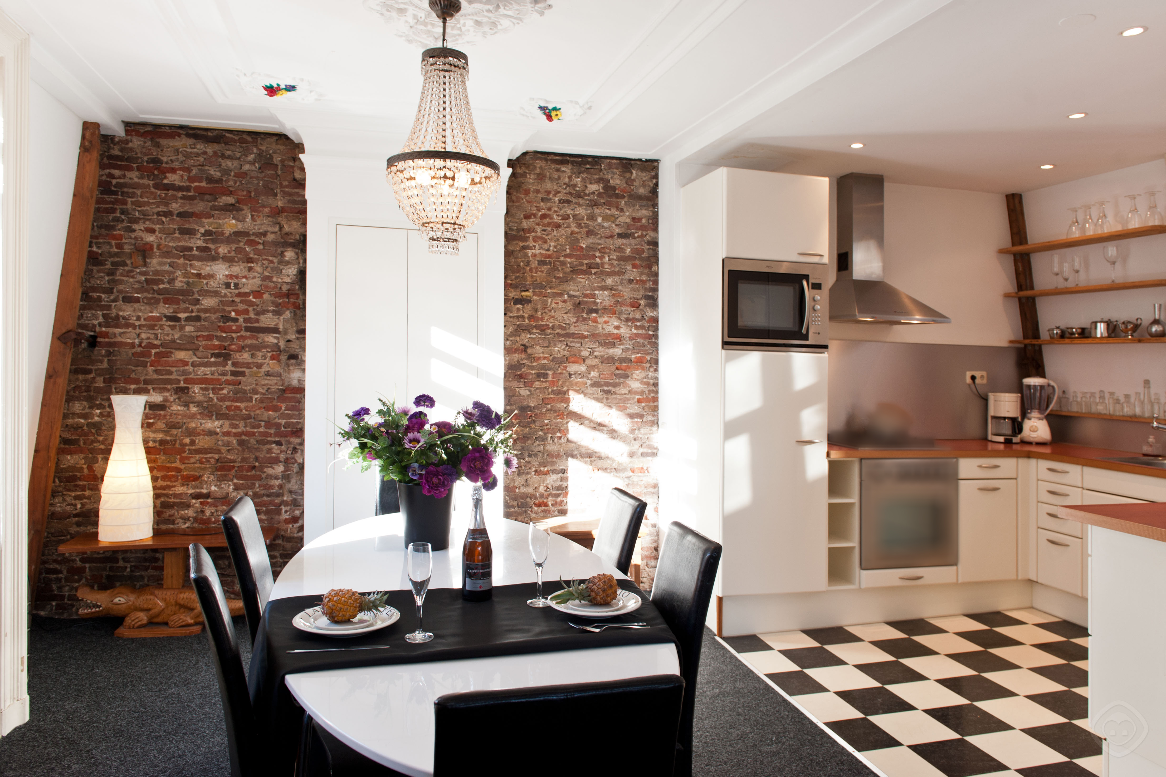 Dining tabke with the view of kitchen Canal Holiday apartment Amsterdam